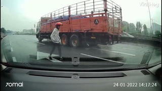 Motorcyclist nearly run over after crashing on highway!